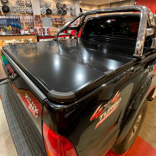 TAPA TRIPLE PAÑO TOYOTA HILUX 05/15 BRACCO